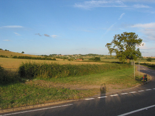 [PHOTO: Brill turning (as elsewhere).  A Beautiful sunny evening, blue sky, green fields… and a bike! 59kB]