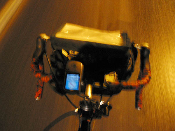 [PHOTO: nighttime blurry shot of bike handlebars: 39kB]