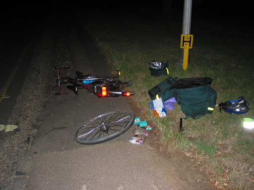 [PHOTO: flash photo of lonely nocturnal roadside repairs: 82kB]