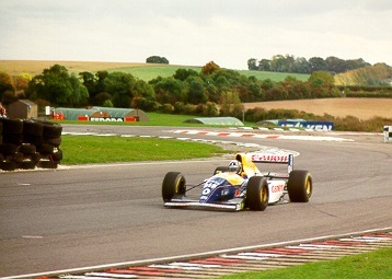 [PHOTO: Damon accelerating out of tight chicane towards camera: 35kB]