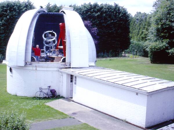 [PHOTO: 36-inch dome with Roger Griffin and telescope visible at open shutters: 43kB]
