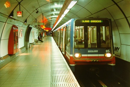 [PHOTO: DLR train in tube platform: 49kB]