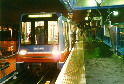 [PHOTO: flashless nighttime view of DLR train in station: 53kB]