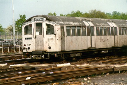 [PHOTO: front car of train in yard, sunny: 58kB]