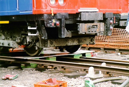 A stock, front bogie jacked up: 67kB]